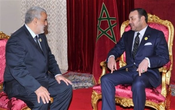In this photo provided by the Moroccan Royal Palace, King Mohammed VI, right, receives Abdelilah Benkirane, the secretary general of the Justice and Development Party, to appoint him as the head of the country's new government, in the mountain town of Midelt, Morocco, Tuesday, Nov. 29, 2011. The Islamist party took 107 seats out of the 395 in Parliament in Friday's election - almost twice as many as the second-place finisher. It must now assemble a governing coalition. Several parties have already expressed their interest in an alliance. (AP Photo/Azzouz Boukallouch)