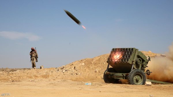TOPSHOT - Armed Yemeni tribesmen from the Popular Resistance Committees, supporting forces loyal to Yemen's Saudi-backed President Abedrabbo Mansour Hadi, fire as they hold a position in the area of Sirwah, west of Marib city, on December 18, 2015. A Yemen ceasefire appeared to have collapsed as government forces captured two towns from rebels and an allied Arab coalition accused insurgents of escalating the conflict by firing ballistic missiles. / AFP / ABDULLAH AL-QADRY (Photo credit should read ABDULLAH AL-QADRY/AFP/Getty Images)